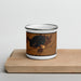 Front View Custom Fox Lake Wisconsin Map Enamel Mug in Ember on Cutting Board