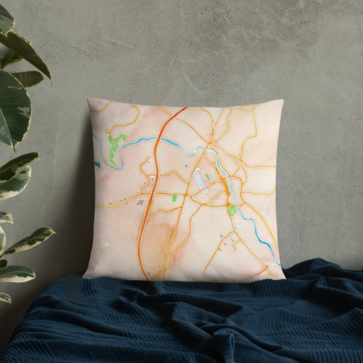 Custom Fredericksburg Virginia Map Throw Pillow in Watercolor on Bedding Against Wall