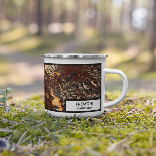 Right View Custom Fremont California Map Enamel Mug in Ember on Grass With Trees in Background