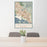 24x36 Fremont California Map Print Portrait Orientation in Woodblock Style Behind 2 Chairs Table and Potted Plant