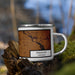 Right View Custom Fremont Nebraska Map Enamel Mug in Ember on Grass With Trees in Background
