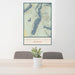 24x36 Fremont Lake Wyoming Map Print Portrait Orientation in Woodblock Style Behind 2 Chairs Table and Potted Plant