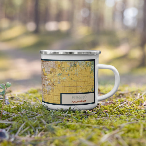 Right View Custom Fresno California Map Enamel Mug in Woodblock on Grass With Trees in Background
