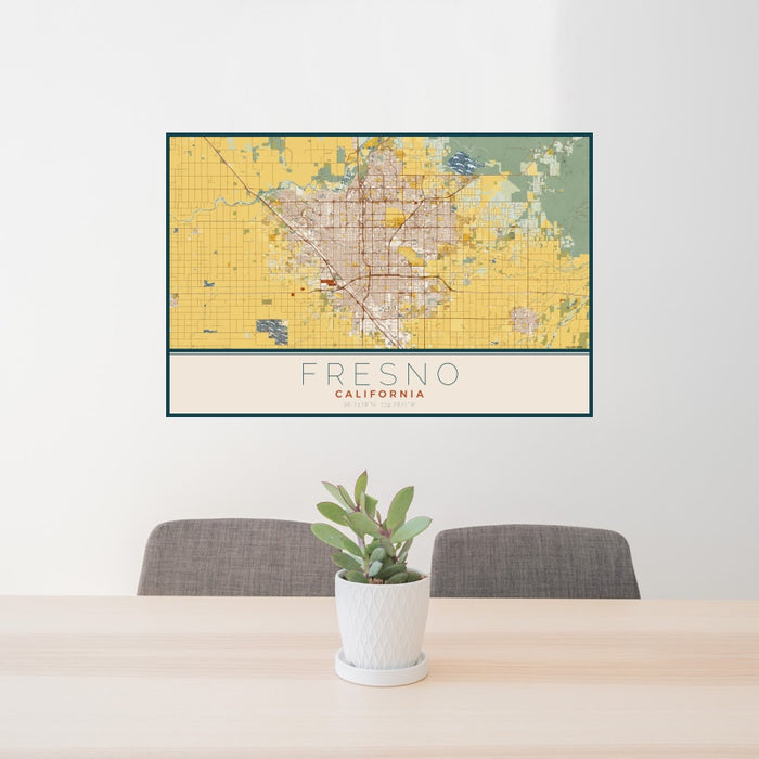 24x36 Fresno California Map Print Landscape Orientation in Woodblock Style Behind 2 Chairs Table and Potted Plant