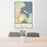 24x36 Friday Harbor Washington Map Print Portrait Orientation in Woodblock Style Behind 2 Chairs Table and Potted Plant