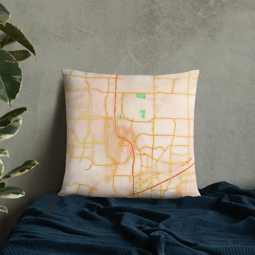Custom Frisco Texas Map Throw Pillow in Watercolor on Bedding Against Wall