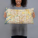 Person holding 20x12 Custom Frisco Texas Map Throw Pillow in Woodblock