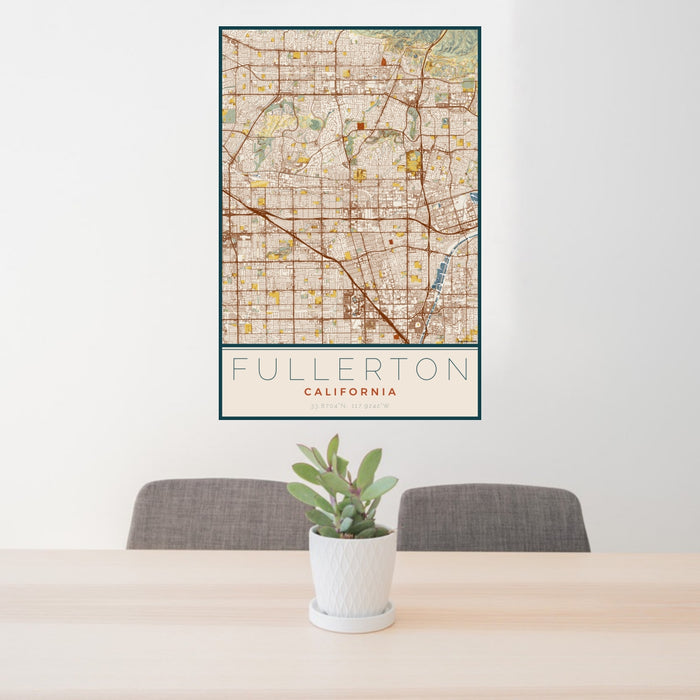 24x36 Fullerton California Map Print Portrait Orientation in Woodblock Style Behind 2 Chairs Table and Potted Plant