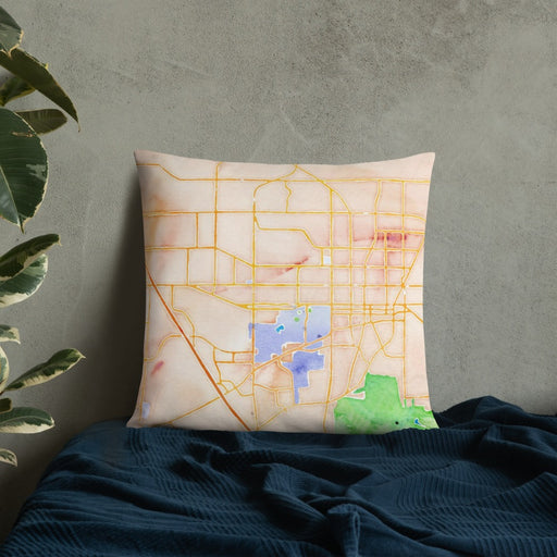 Custom Gainesville Florida Map Throw Pillow in Watercolor on Bedding Against Wall