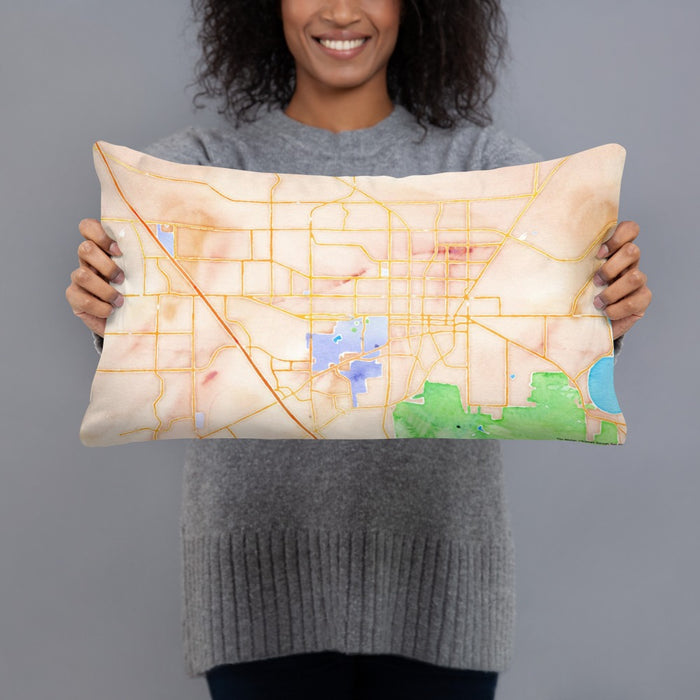 Person holding 20x12 Custom Gainesville Florida Map Throw Pillow in Watercolor
