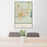 24x36 Gainesville Florida Map Print Portrait Orientation in Woodblock Style Behind 2 Chairs Table and Potted Plant