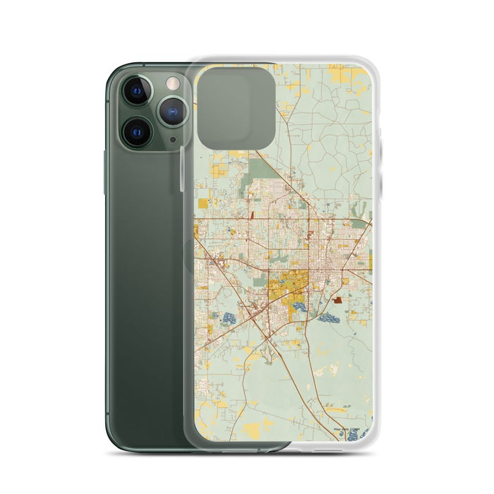 Custom Gainesville Florida Map Phone Case in Woodblock on Table with Laptop and Plant
