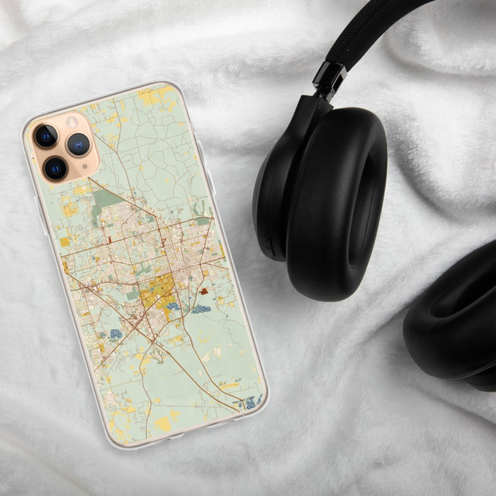 Custom Gainesville Florida Map Phone Case in Woodblock on Table with Black Headphones