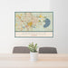 24x36 Gainesville Florida Map Print Landscape Orientation in Woodblock Style Behind 2 Chairs Table and Potted Plant