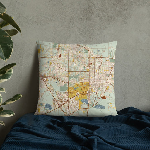 Custom Gainesville Florida Map Throw Pillow in Woodblock on Bedding Against Wall