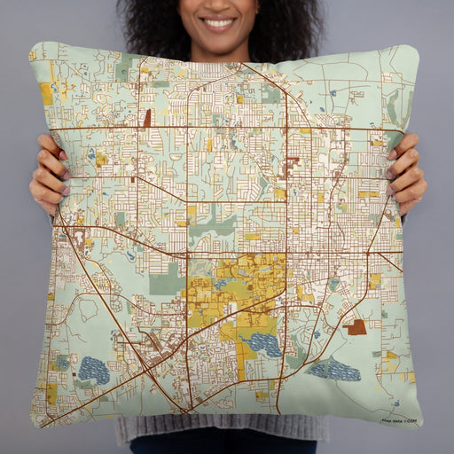 Person holding 22x22 Custom Gainesville Florida Map Throw Pillow in Woodblock