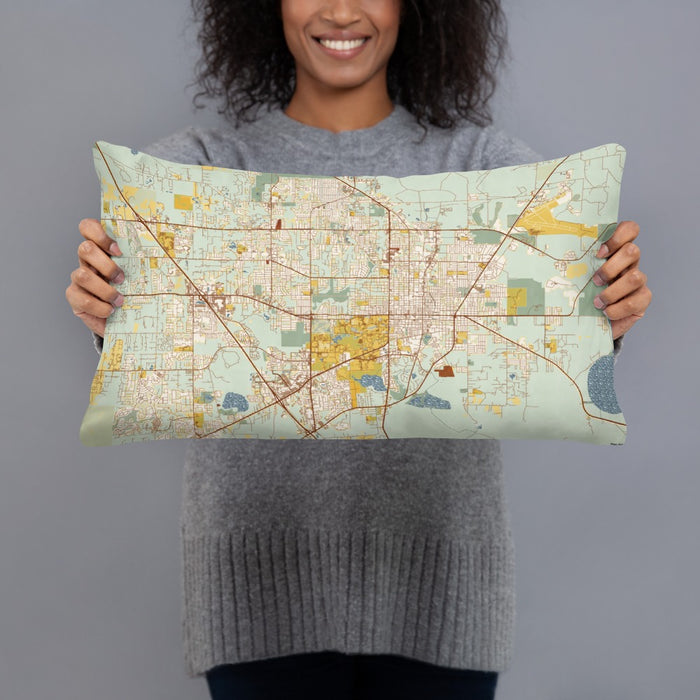 Person holding 20x12 Custom Gainesville Florida Map Throw Pillow in Woodblock