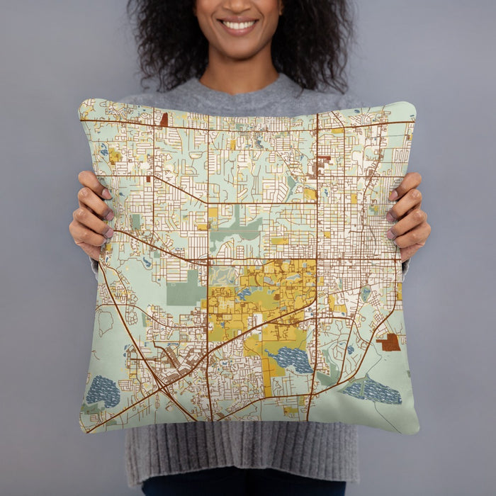 Person holding 18x18 Custom Gainesville Florida Map Throw Pillow in Woodblock