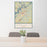 24x36 Gainesville Georgia Map Print Portrait Orientation in Woodblock Style Behind 2 Chairs Table and Potted Plant