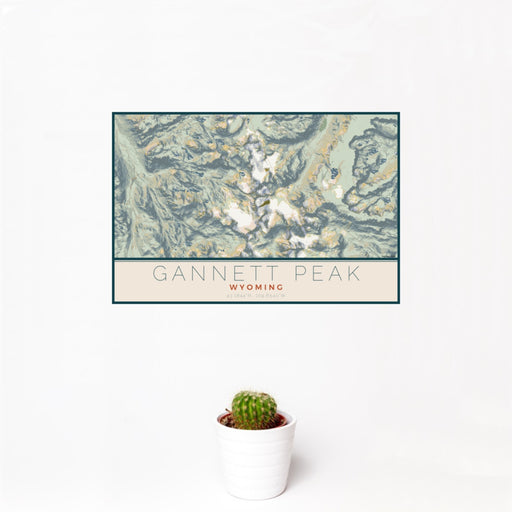 12x18 Gannett Peak Wyoming Map Print Landscape Orientation in Woodblock Style With Small Cactus Plant in White Planter