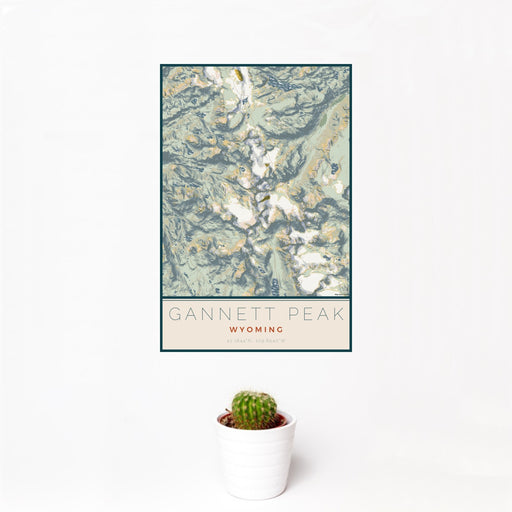 12x18 Gannett Peak Wyoming Map Print Portrait Orientation in Woodblock Style With Small Cactus Plant in White Planter