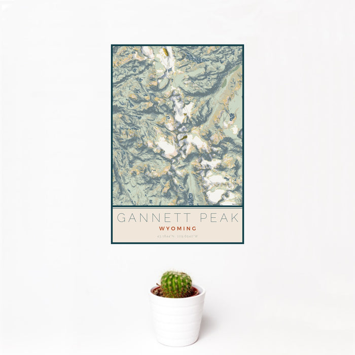 12x18 Gannett Peak Wyoming Map Print Portrait Orientation in Woodblock Style With Small Cactus Plant in White Planter