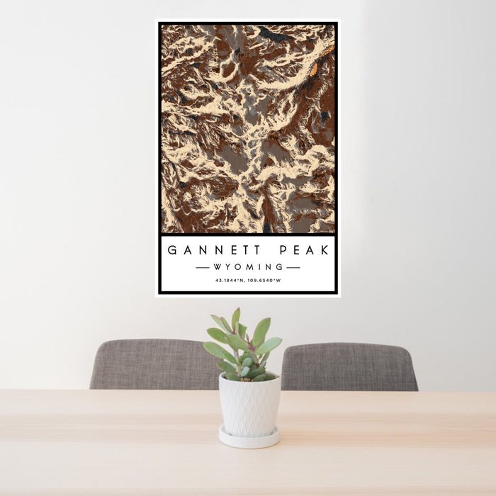 24x36 Gannett Peak Wyoming Map Print Portrait Orientation in Ember Style Behind 2 Chairs Table and Potted Plant
