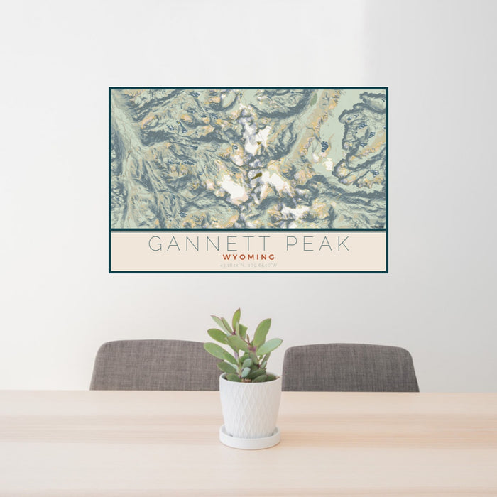24x36 Gannett Peak Wyoming Map Print Lanscape Orientation in Woodblock Style Behind 2 Chairs Table and Potted Plant