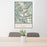 24x36 Gannett Peak Wyoming Map Print Portrait Orientation in Woodblock Style Behind 2 Chairs Table and Potted Plant