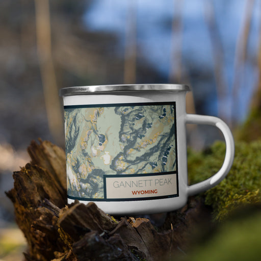 Right View Custom Gannett Peak Wyoming Map Enamel Mug in Woodblock on Grass With Trees in Background
