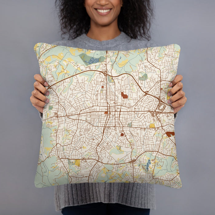 Person holding 18x18 Custom Gastonia North Carolina Map Throw Pillow in Woodblock