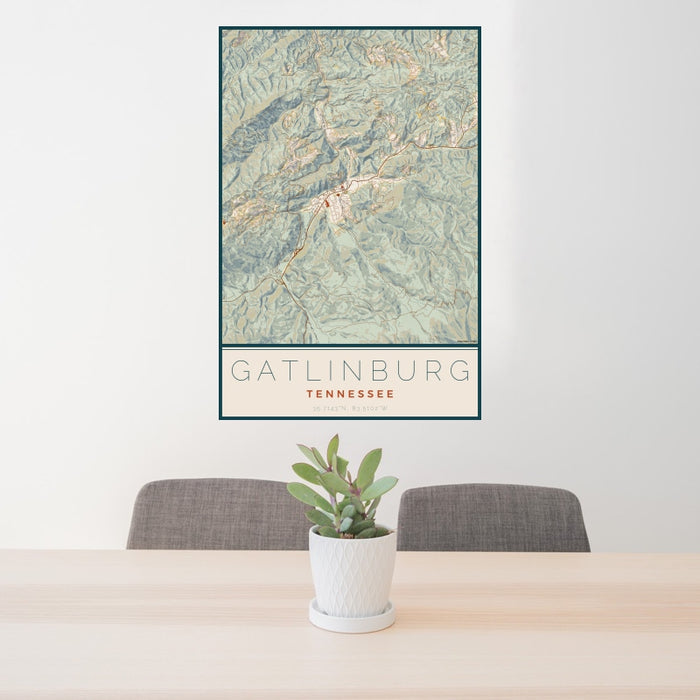 24x36 Gatlinburg Tennessee Map Print Portrait Orientation in Woodblock Style Behind 2 Chairs Table and Potted Plant