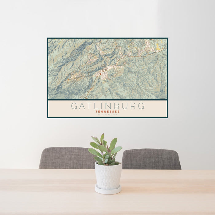 24x36 Gatlinburg Tennessee Map Print Landscape Orientation in Woodblock Style Behind 2 Chairs Table and Potted Plant