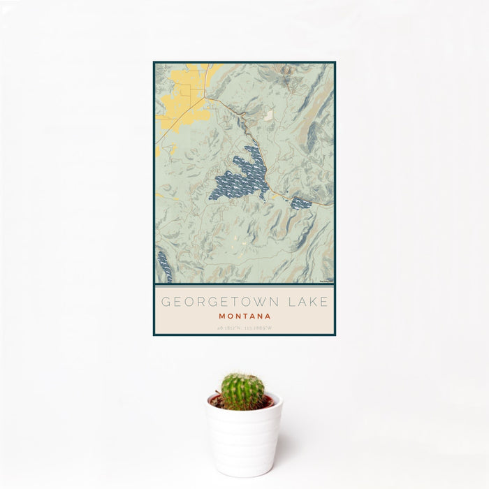 12x18 Georgetown Lake Montana Map Print Portrait Orientation in Woodblock Style With Small Cactus Plant in White Planter