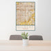 24x36 Gilbert Arizona Map Print Portrait Orientation in Woodblock Style Behind 2 Chairs Table and Potted Plant