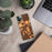 Custom Gillette Wyoming Map Phone Case in Ember on Table with Laptop and Plant