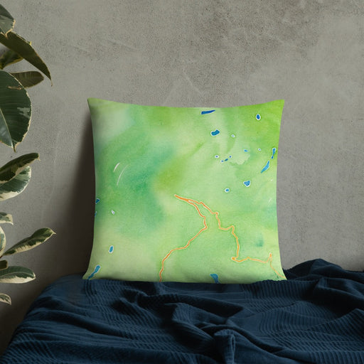 Custom Glacier National Park Map Throw Pillow in Watercolor on Bedding Against Wall