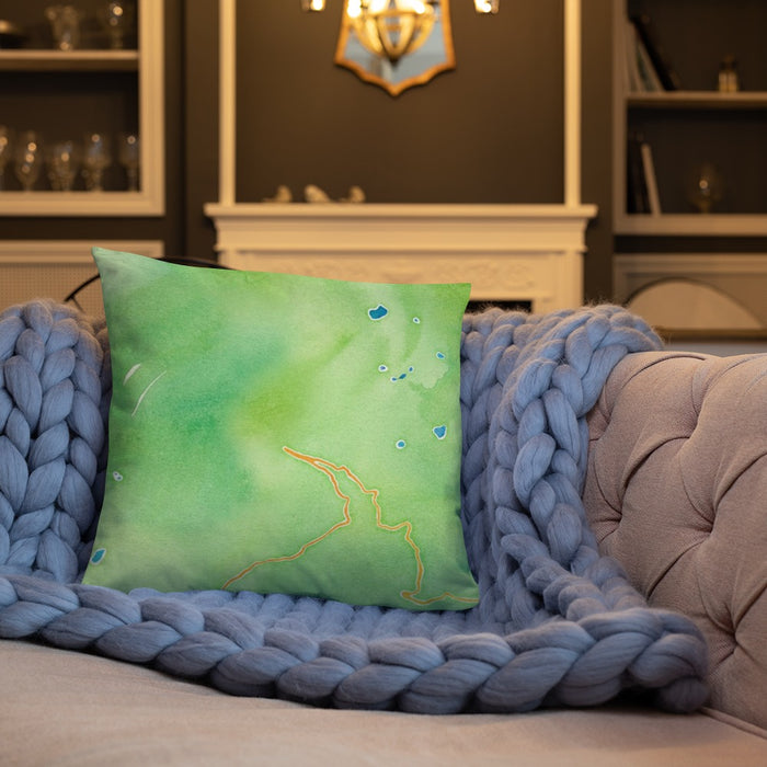 Custom Glacier National Park Map Throw Pillow in Watercolor on Cream Colored Couch