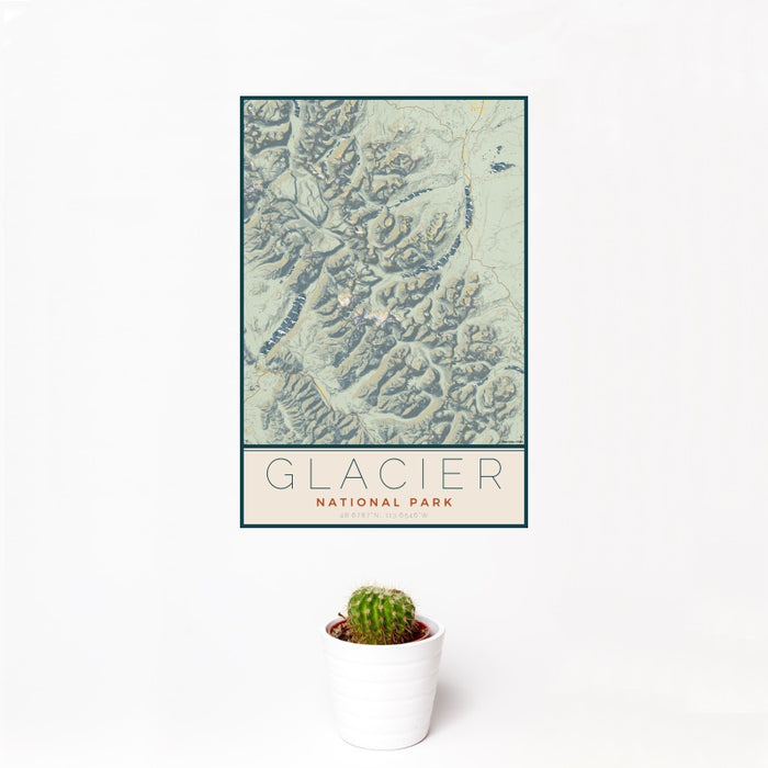 12x18 Glacier National Park Map Print Portrait Orientation in Woodblock Style With Small Cactus Plant in White Planter