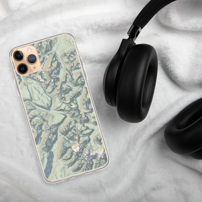 Custom Glacier National Park Map Phone Case in Woodblock on Table with Black Headphones