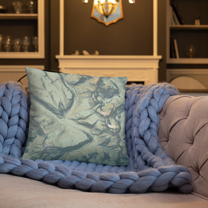 Custom Glacier National Park Map Throw Pillow in Woodblock on Cream Colored Couch
