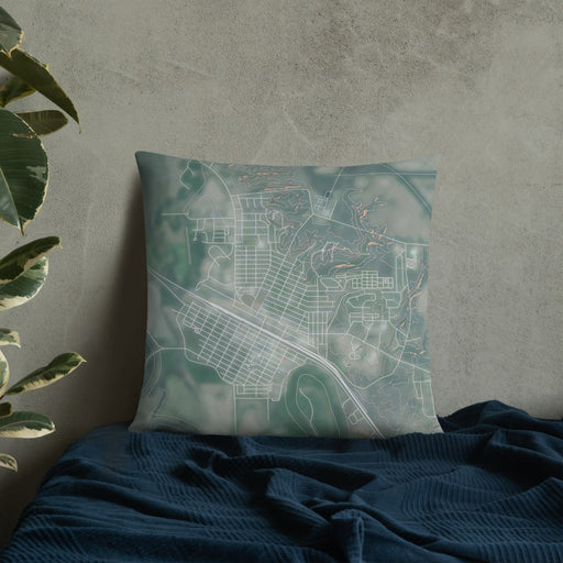 Custom Glasgow Montana Map Throw Pillow in Afternoon on Bedding Against Wall