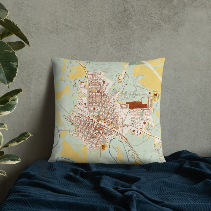 Custom Glasgow Montana Map Throw Pillow in Woodblock on Bedding Against Wall
