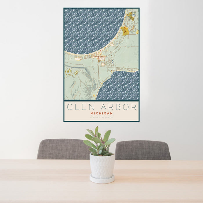 24x36 Glen Arbor Michigan Map Print Portrait Orientation in Woodblock Style Behind 2 Chairs Table and Potted Plant