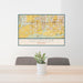 24x36 Goodyear Arizona Map Print Lanscape Orientation in Woodblock Style Behind 2 Chairs Table and Potted Plant