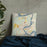 Custom Granbury Texas Map Throw Pillow in Woodblock on Bedding Against Wall