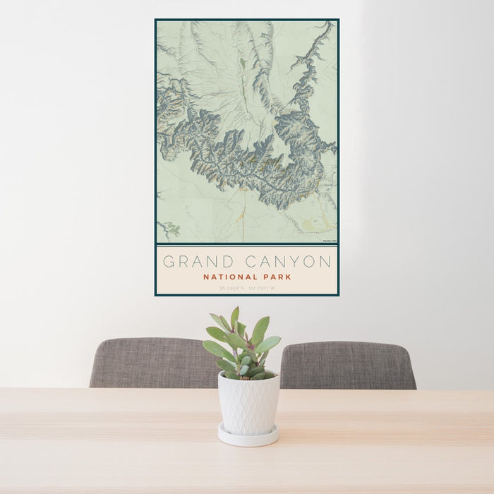 24x36 Grand Canyon National Park Map Print Portrait Orientation in Woodblock Style Behind 2 Chairs Table and Potted Plant