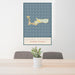 24x36 Grand Cayman Cayman Islands Map Print Portrait Orientation in Woodblock Style Behind 2 Chairs Table and Potted Plant