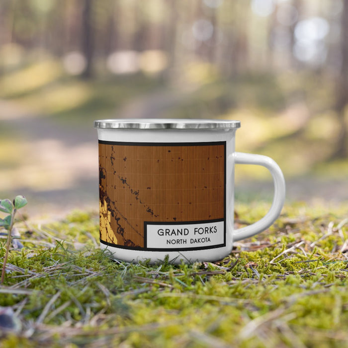 Right View Custom Grand Forks North Dakota Map Enamel Mug in Ember on Grass With Trees in Background
