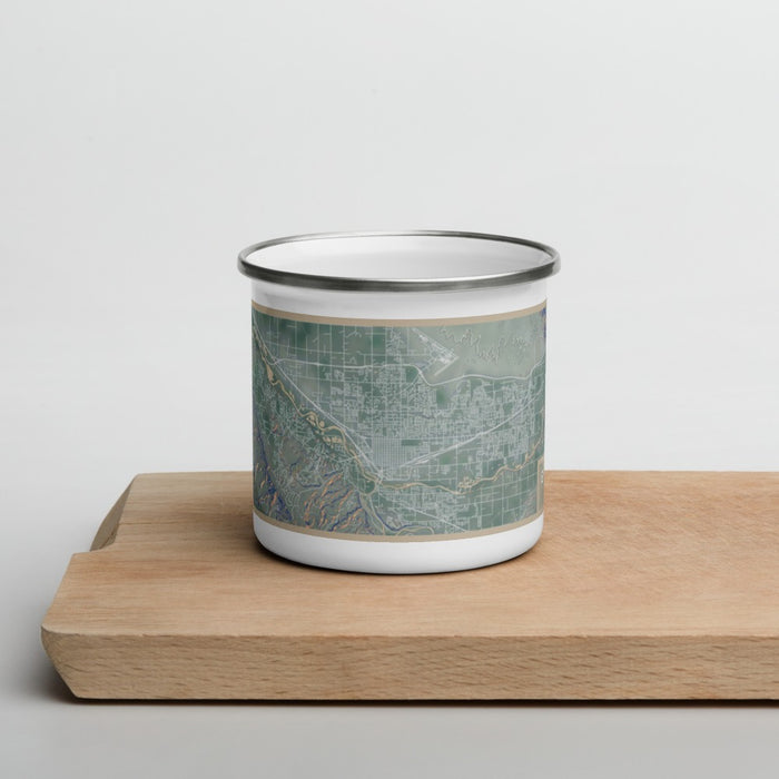 Front View Custom Grand Junction Colorado Map Enamel Mug in Afternoon on Cutting Board
